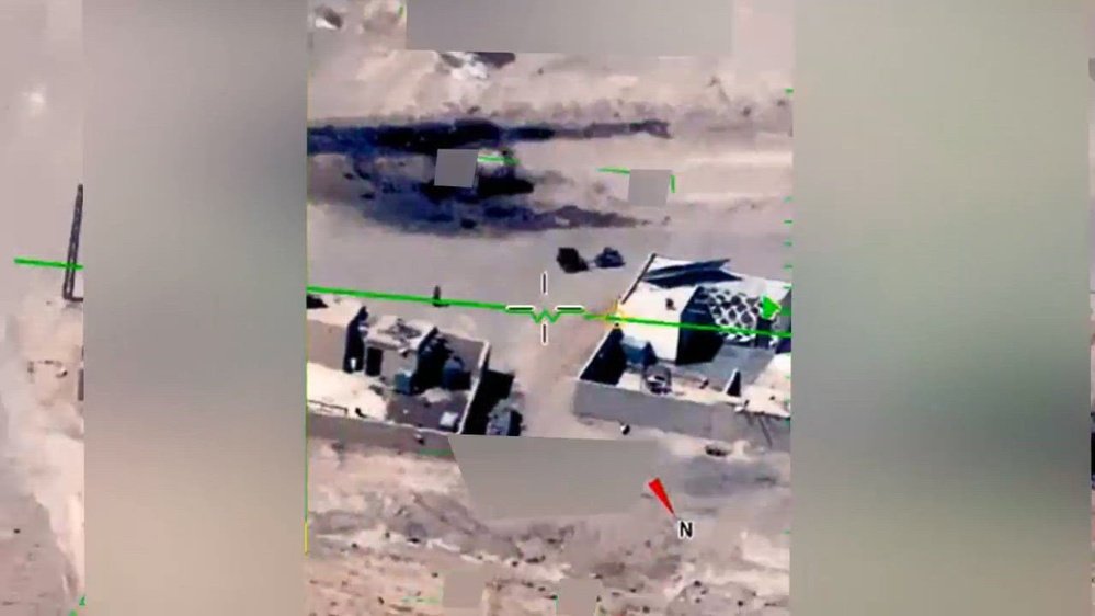 Official still frame from the U.S. Department of Defense's declassified 'Middle East Object' MQ-9 Reaper drone video, showing the small silvery sphere at the center of this case over desert terrain near Deir ez-Zor, Syria