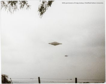 The Calvine UFO photograph, August 4, 1990, showing a diamond-shaped craft and a Harrier jet in the background.