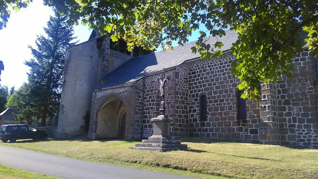 Église Saint-Amand, the parish church of Cussac, Cantal, France — the small Auvergne plateau hamlet where the 1967 close encounter occurred. This photograph shows the village itself, not the pasture at Les Tuiles where the sighting took place.