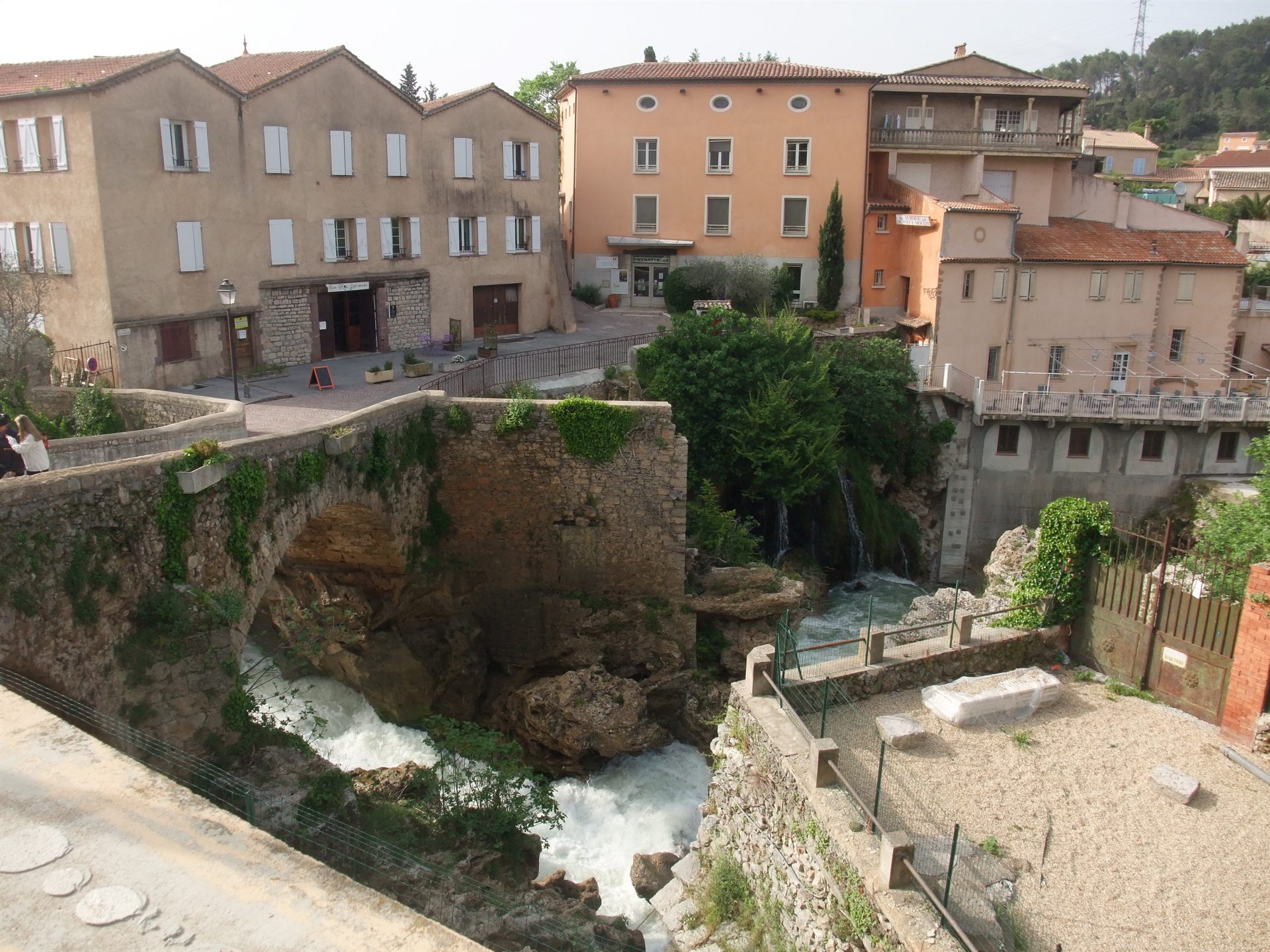 The village of Trans-en-Provence in the Var department of Provence, France, showing the historic town center and the Nartuby waterfall — the commune where Renato Nicolaï's property, the site of the January 1981 landing, is located. This photograph shows the town itself, not the private garden terrace where the sighting occurred.